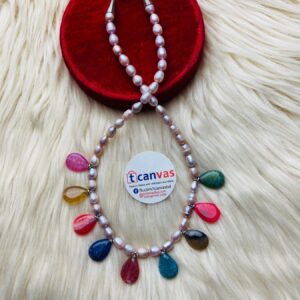 Pearl and stone made necklace